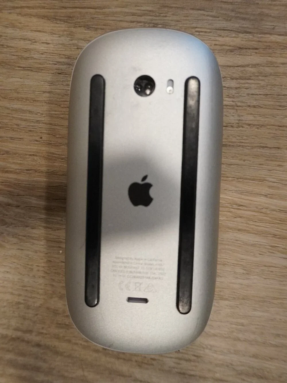 Chargeable Apple Wireless Magic Mouse in White and Silver with Black Feet